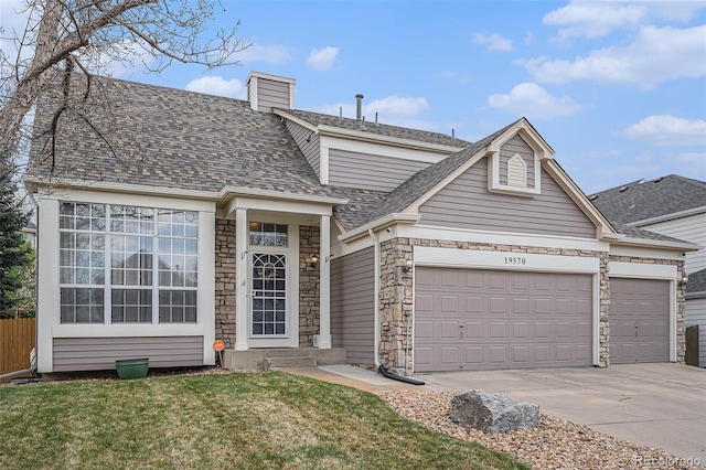 traditional home featuring a garage, concrete driveway, stone siding, a chimney, and roof with shingles