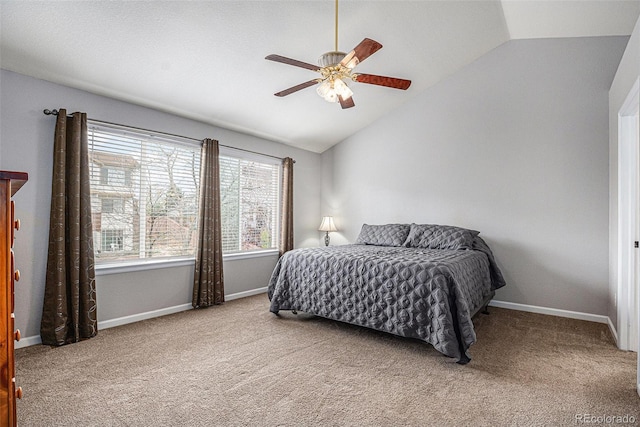 bedroom featuring lofted ceiling, carpet, baseboards, and ceiling fan