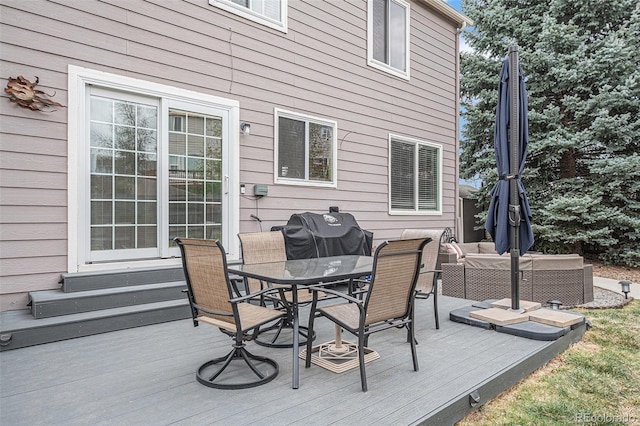 deck with outdoor dining space, an outdoor hangout area, entry steps, and a grill