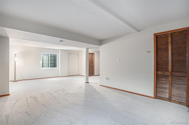 unfurnished room with light carpet and baseboards