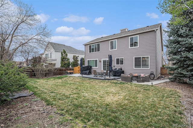 back of property with an outdoor living space, a patio, and a chimney