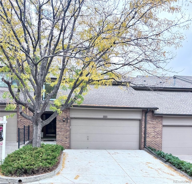 ranch-style home featuring a garage