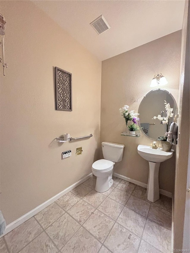 bathroom featuring toilet