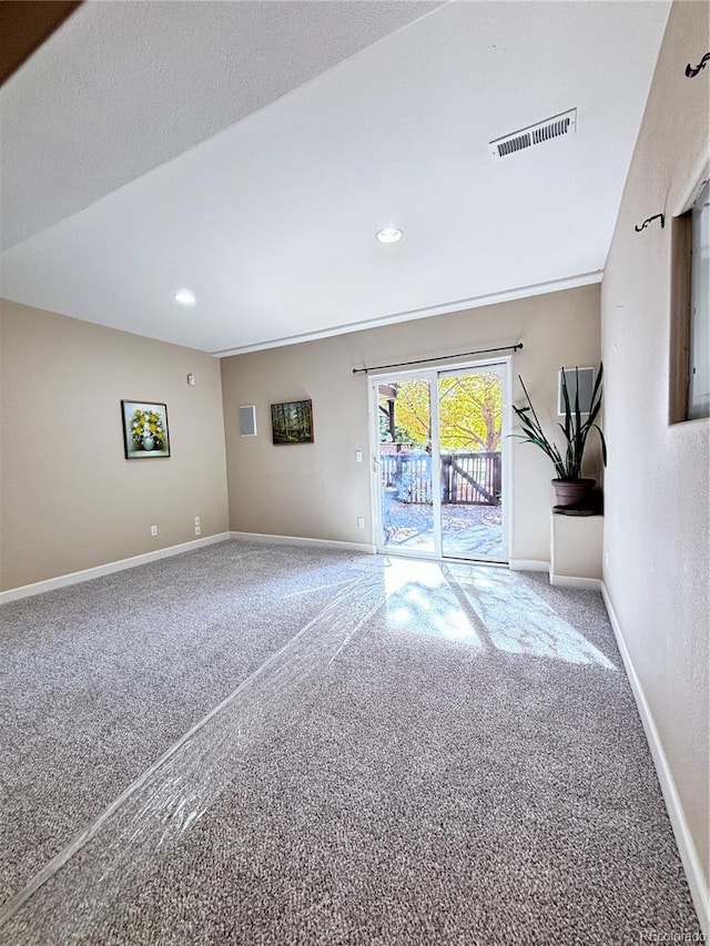 spare room featuring carpet flooring