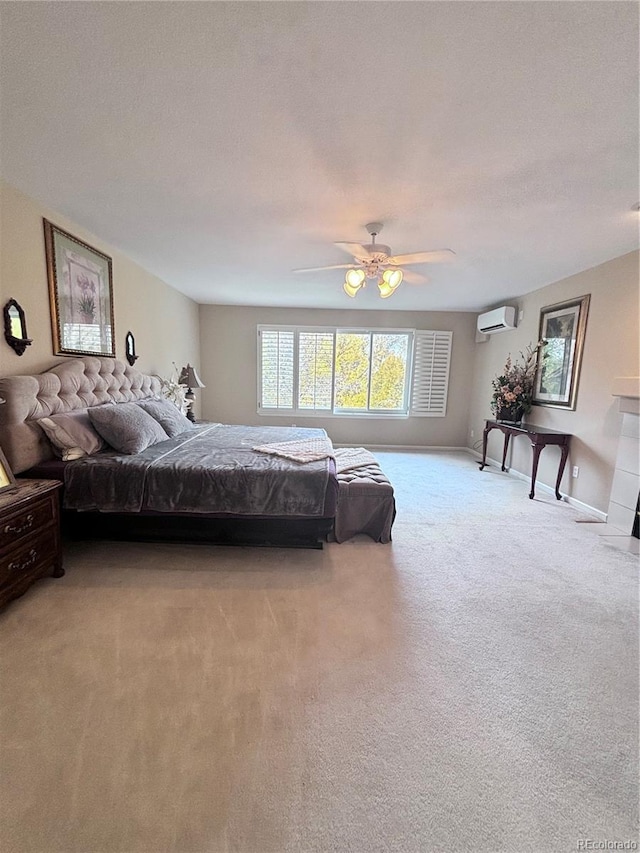 carpeted bedroom with a wall mounted air conditioner and ceiling fan