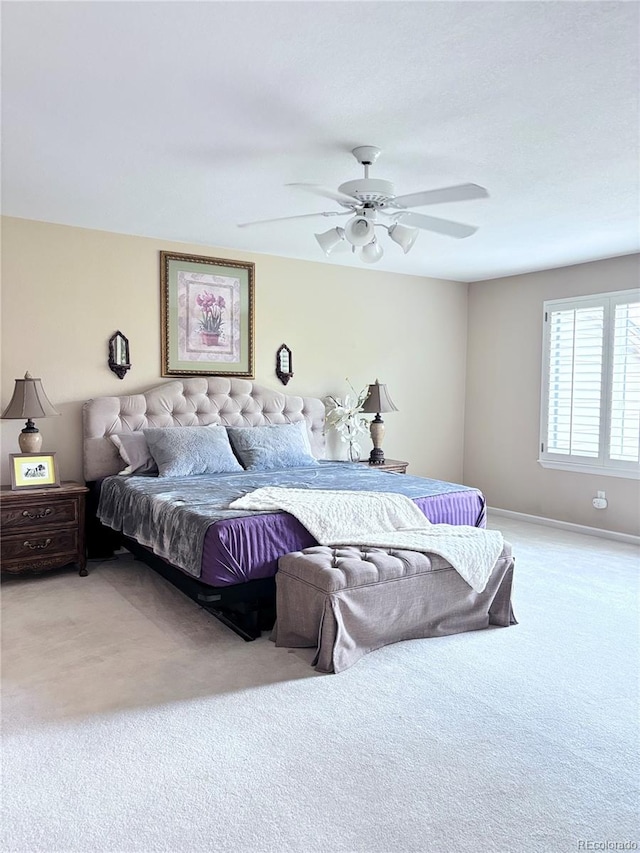 carpeted bedroom featuring ceiling fan