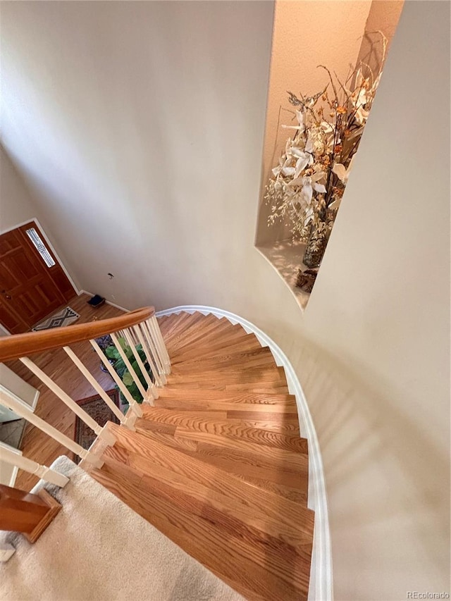 stairs with wood-type flooring