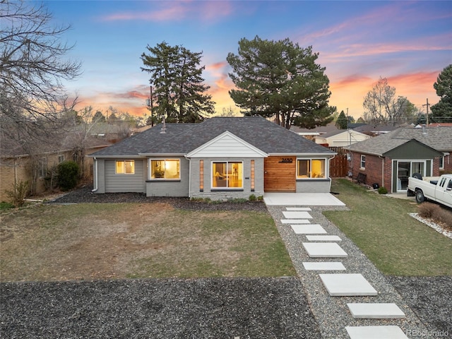 view of front of home featuring a front yard and fence