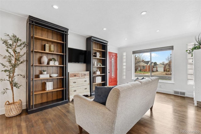 living room featuring dark wood finished floors, baseboards, visible vents, and recessed lighting