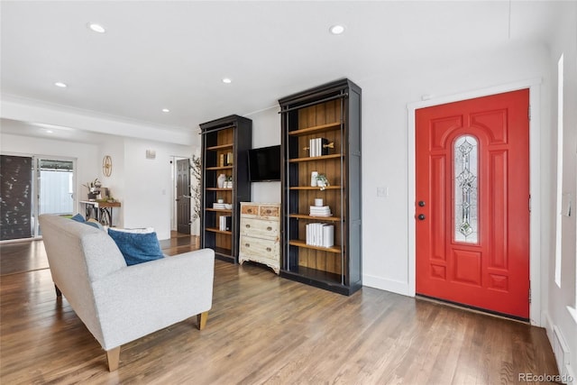 living room featuring baseboards, recessed lighting, and dark wood finished floors