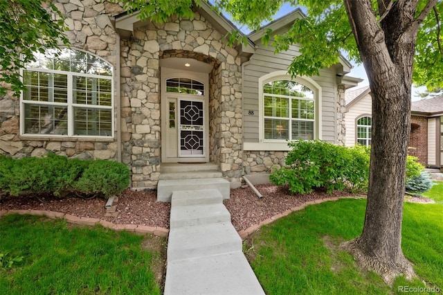 6900 W Grant Ranch Blvd Unit 88, Denver, CO 80123 - view of exterior entry with stone siding