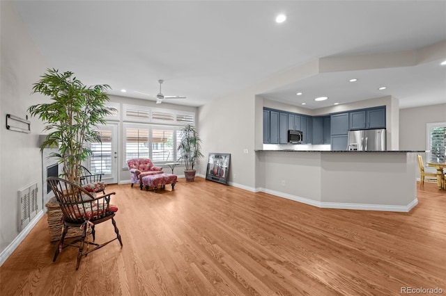 6900 W Grant Ranch Blvd Unit 88, Denver, CO 80123 - living area with light wood-style flooring, baseboards, recessed lighting, and a ceiling fan