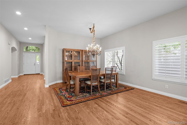 6900 W Grant Ranch Blvd Unit 88, Denver, CO 80123 - dining room featuring a chandelier, light wood-style floors, arched walkways, baseboards, and recessed lighting