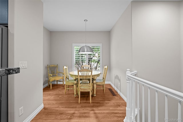 6900 W Grant Ranch Blvd Unit 88, Denver, CO 80123 - dining room with light wood-style floors and baseboards
