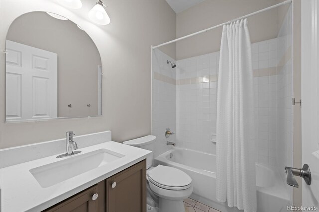 6900 W Grant Ranch Blvd Unit 88, Denver, CO 80123 - bathroom with vanity, shower / bathtub combination with curtain, toilet, and tile patterned floors