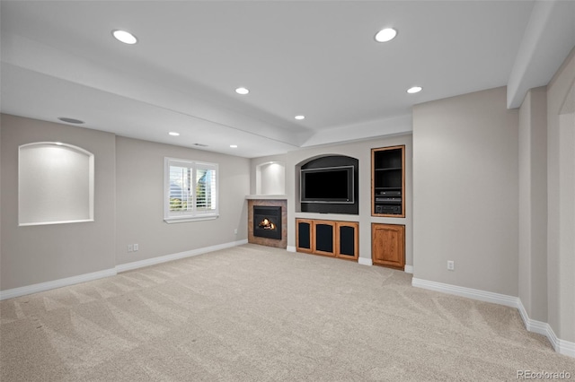 6900 W Grant Ranch Blvd Unit 88, Denver, CO 80123 - unfurnished living room featuring light colored carpet, recessed lighting, baseboards, and a fireplace