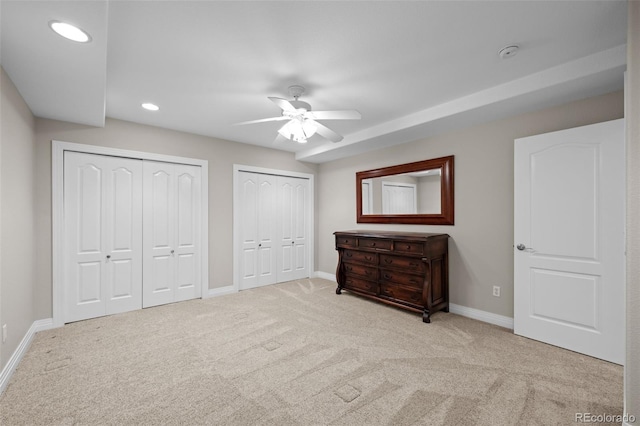 6900 W Grant Ranch Blvd Unit 88, Denver, CO 80123 - unfurnished bedroom with baseboards, carpet, multiple closets, recessed lighting, and ceiling fan