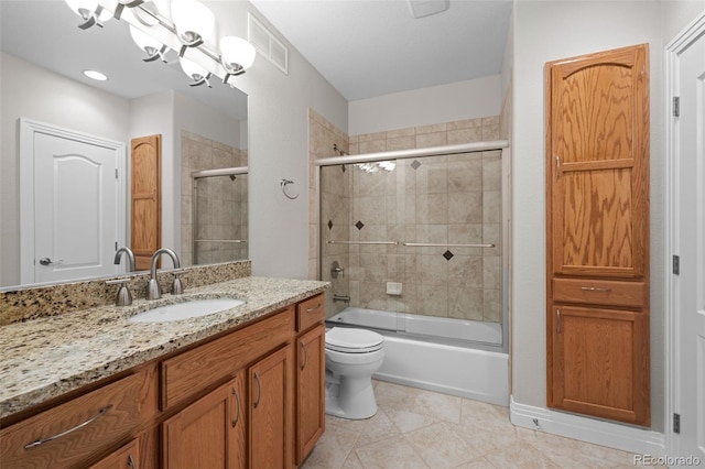 6900 W Grant Ranch Blvd Unit 88, Denver, CO 80123 - full bath with vanity, toilet, bath / shower combo with glass door, and tile patterned floors
