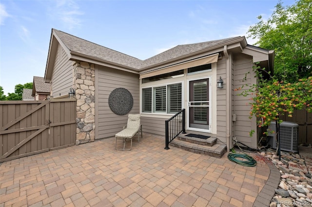 6900 W Grant Ranch Blvd Unit 88, Denver, CO 80123 - view of patio / terrace with cooling unit and a gate