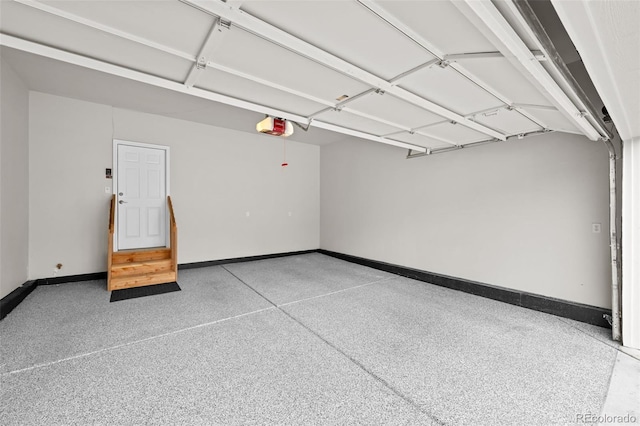 6900 W Grant Ranch Blvd Unit 88, Denver, CO 80123 - garage featuring a garage door opener and baseboards