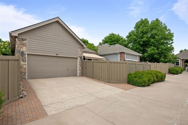 6900 W Grant Ranch Blvd Unit 88, Denver, CO 80123 - view of home's exterior with driveway and a garage