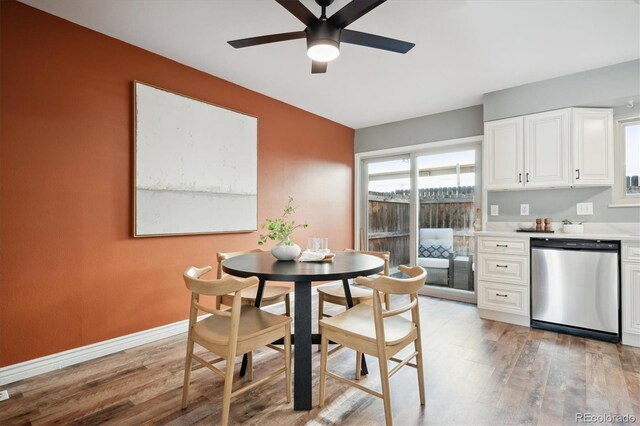 dining space featuring light wood-type flooring, ceiling fan, and baseboards