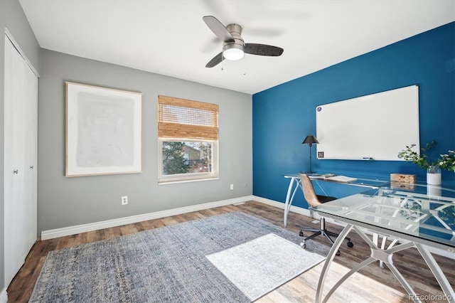 home office with ceiling fan, baseboards, and wood finished floors