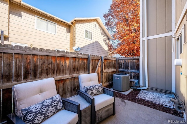 view of patio / terrace with a fenced backyard and central AC unit