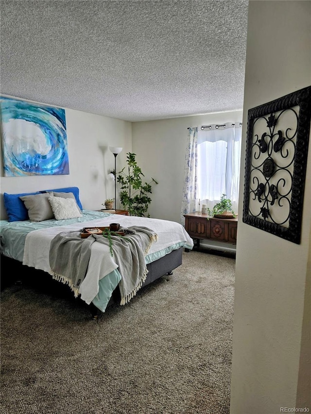 carpeted bedroom with a textured ceiling