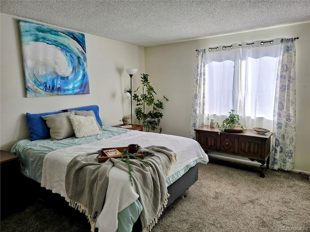 bedroom with light carpet and a textured ceiling