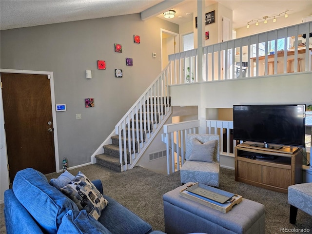 carpeted living room with vaulted ceiling