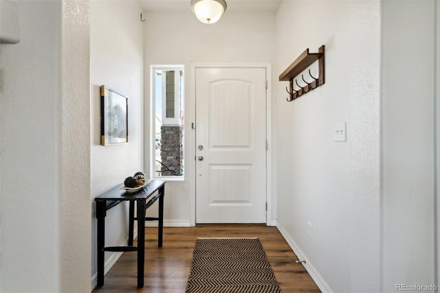 8339 Mosby Way, Colorado Springs, CO 80908 - foyer entrance featuring dark wood-style floors and baseboards
