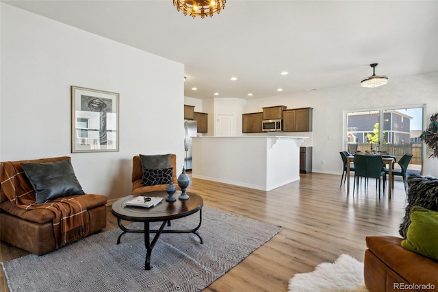 8339 Mosby Way, Colorado Springs, CO 80908 - living area with light wood-style flooring and recessed lighting