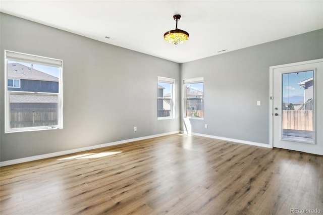 8339 Mosby Way, Colorado Springs, CO 80908 - unfurnished room featuring plenty of natural light and wood finished floors