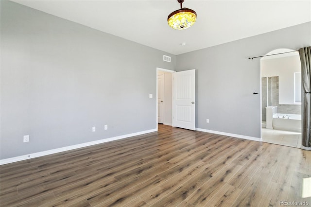 8339 Mosby Way, Colorado Springs, CO 80908 - unfurnished bedroom with wood finished floors and ensuite bath