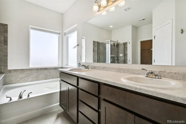 8339 Mosby Way, Colorado Springs, CO 80908 - bathroom with a shower stall, double vanity, a garden tub, a walk in closet, and tile patterned floors