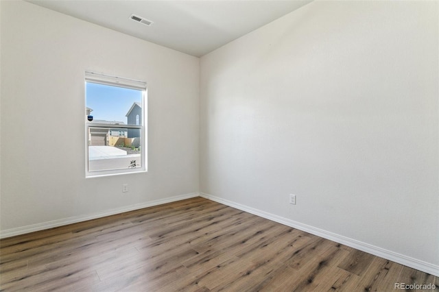 8339 Mosby Way, Colorado Springs, CO 80908 - spare room featuring wood finished floors and baseboards