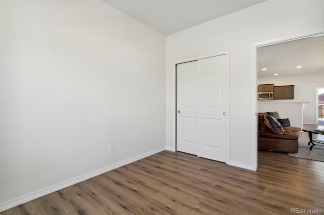 8339 Mosby Way, Colorado Springs, CO 80908 - unfurnished bedroom with wood finished floors, a closet, and recessed lighting