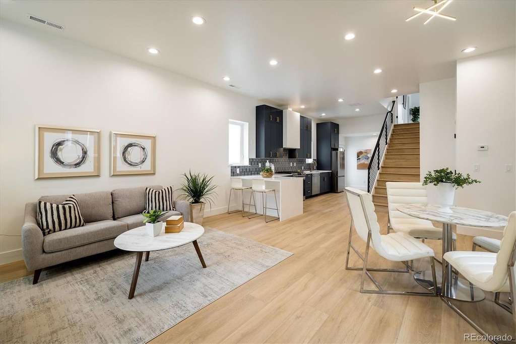 living room with light hardwood / wood-style flooring