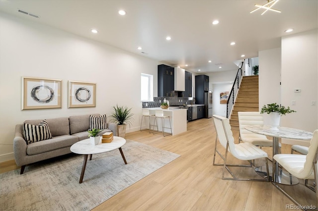 living room with light hardwood / wood-style flooring