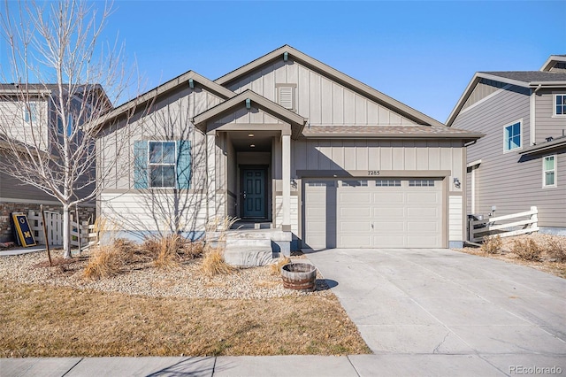 7285 S Titus Way, Aurora, CO 80016 - view of front of home featuring a garage, concrete driveway, and board and batten siding