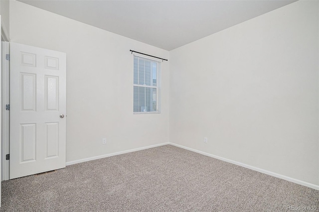 7285 S Titus Way, Aurora, CO 80016 - spare room featuring carpet and baseboards