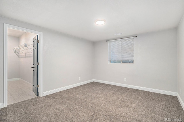 unfurnished room with light colored carpet