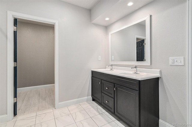 bathroom with hardwood / wood-style flooring and vanity