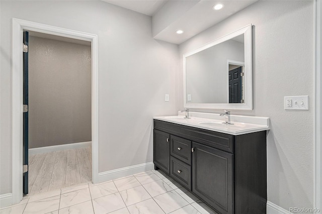7285 S Titus Way, Aurora, CO 80016 - full bath with double vanity, marble look tile flooring, and recessed lighting
