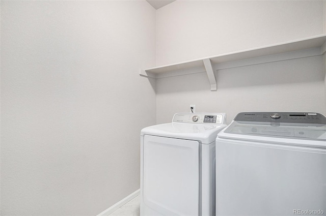 clothes washing area featuring washing machine and dryer