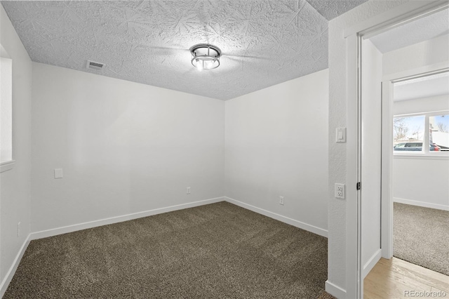 spare room featuring carpet