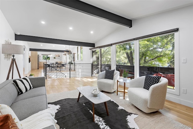 living room featuring hardwood / wood-style floors and lofted ceiling with beams