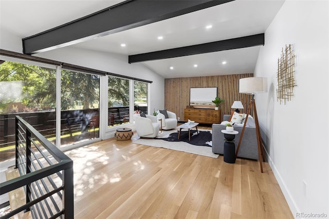 living room with lofted ceiling with beams, wooden walls, and wood-type flooring