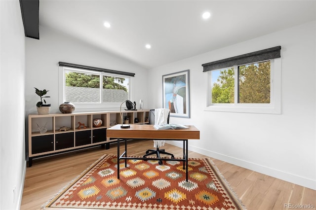 office featuring hardwood / wood-style flooring and lofted ceiling